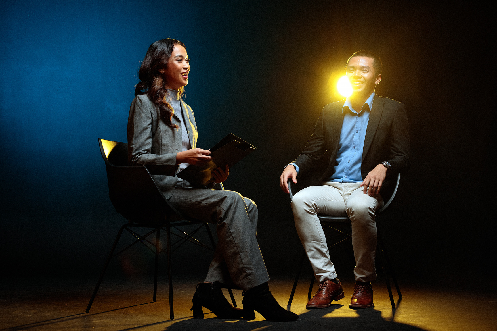 Man and Woman Doing a Talk on Stage